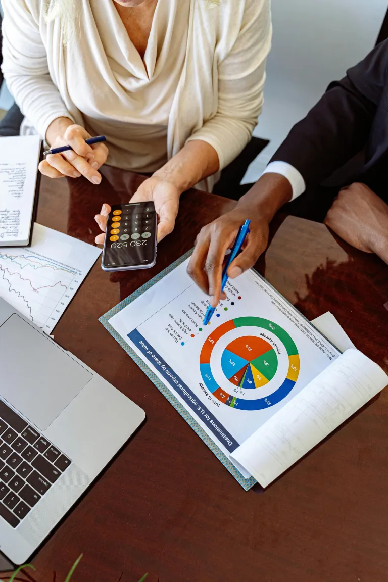Financial professionals reviewing mortgage loan analytics and charts